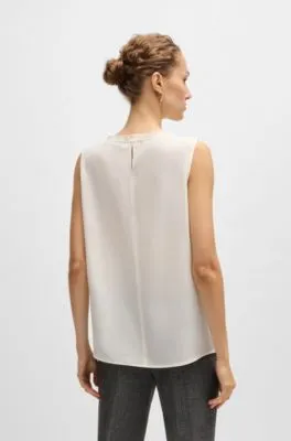 Pleat-front sleeveless blouse in washed silk